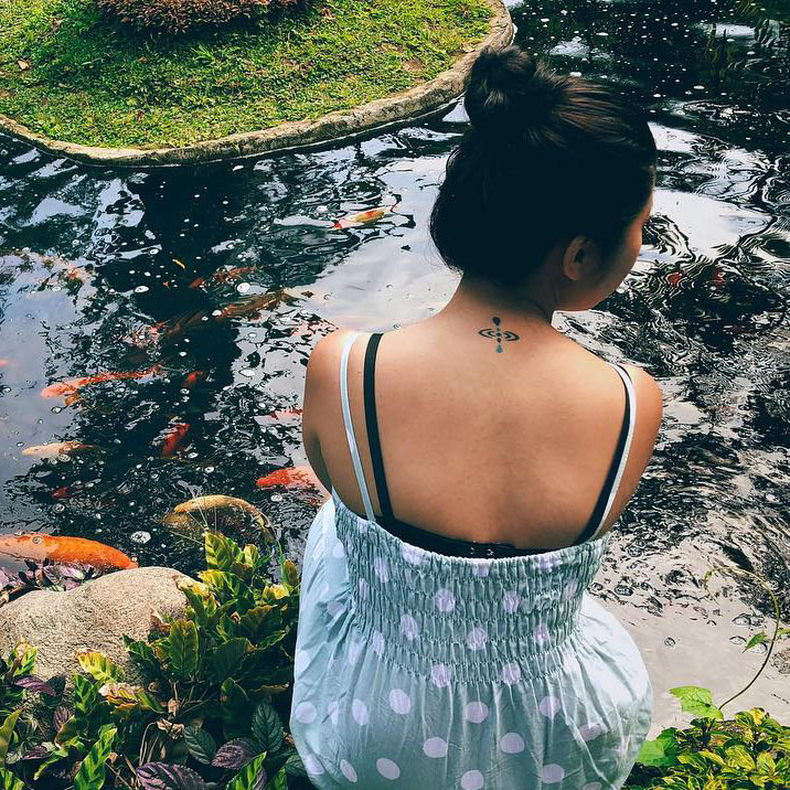 Mindfulness tattoo on the neck