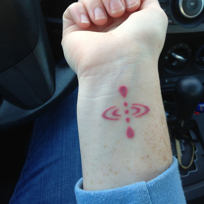 Mindfulness tattoo on a hand