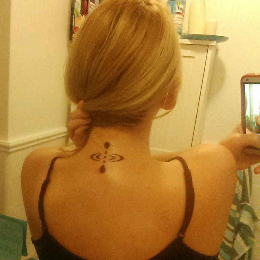 Mindfulness tattoo on the neck